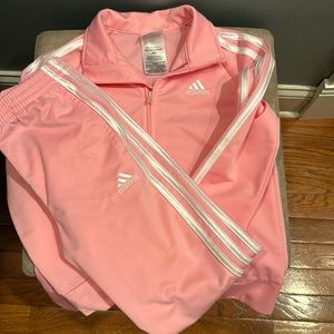 Girl’s pink Adidas track suit